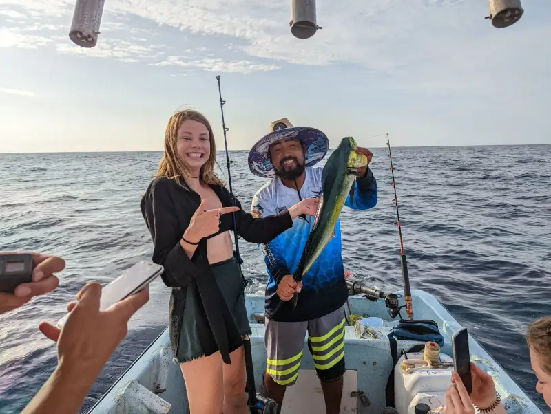 Guest with a mahi mahi on a fishing trip
